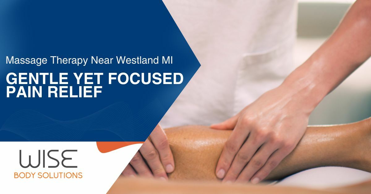 A Massage Therapist Massaging a Patient's Neck and Shoulders Laying On Their Stomach on a Massage Table | Massage Therapy Plymouth, MI | Wise Body Solutions